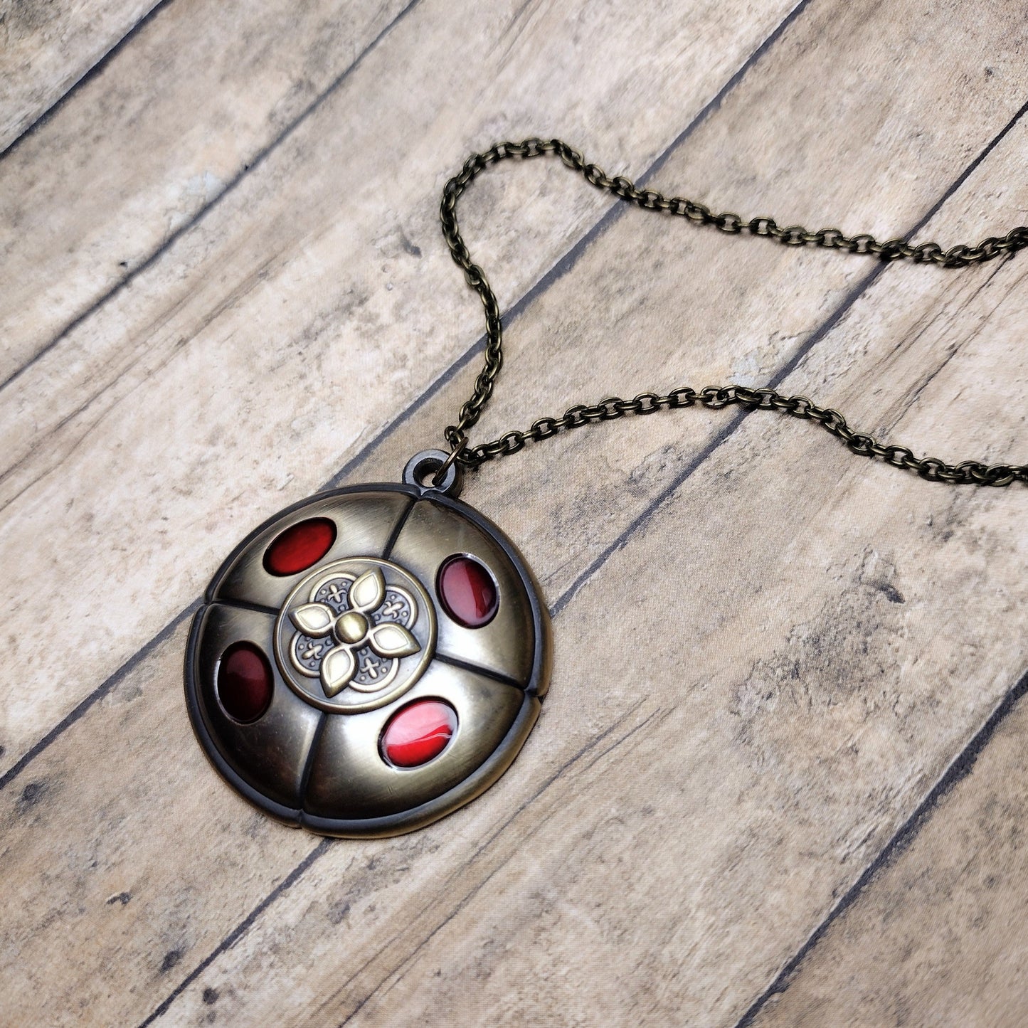 Crimson amber medallion pendant