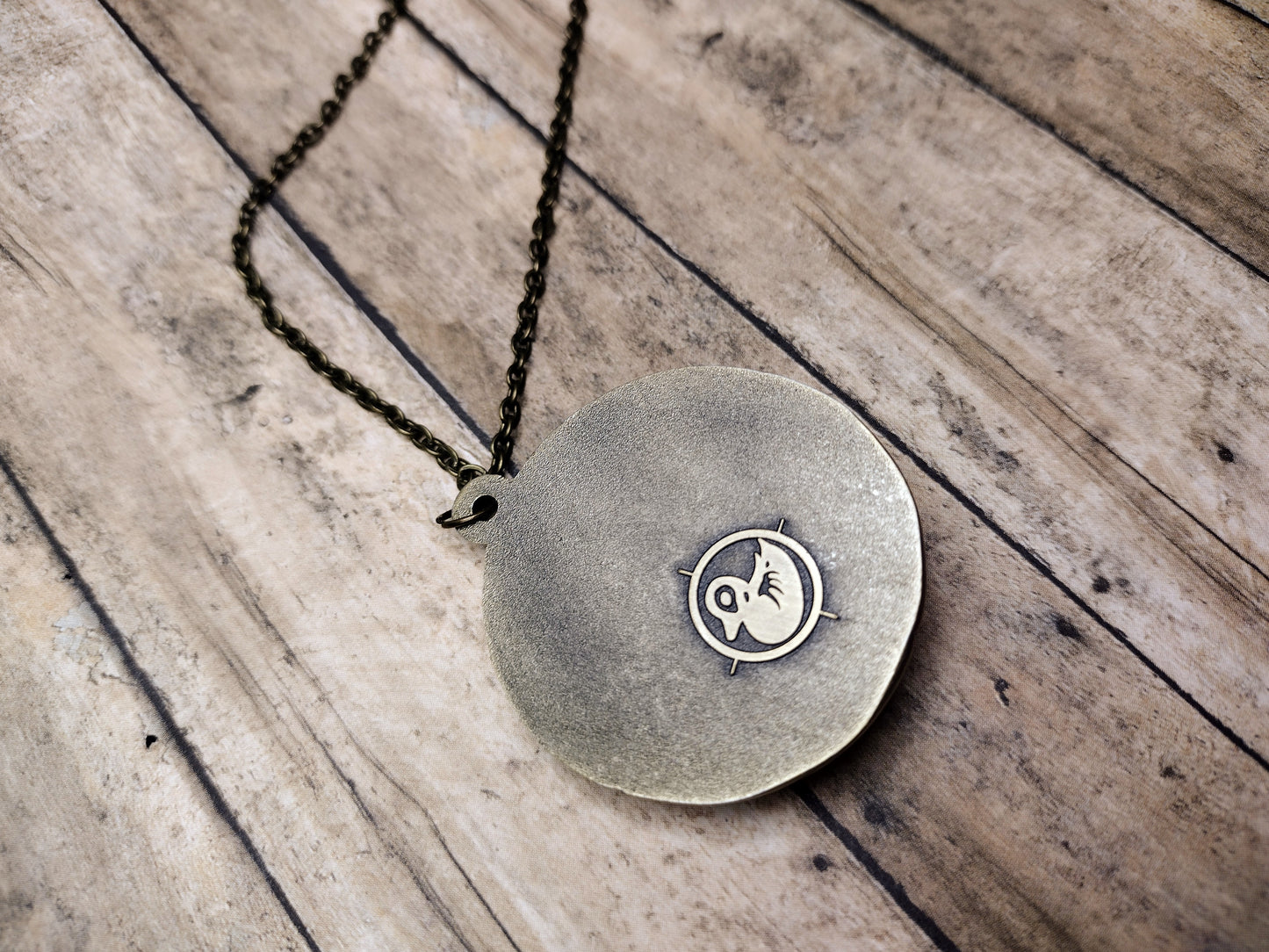 Crimson amber medallion pendant