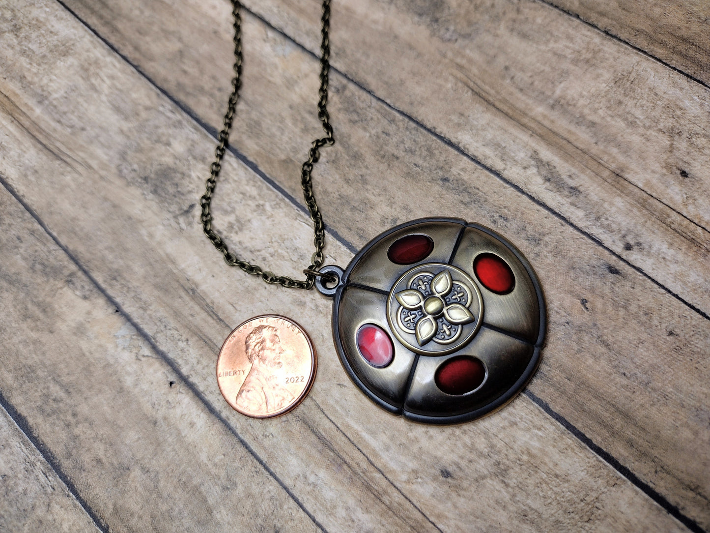 Crimson amber medallion pendant